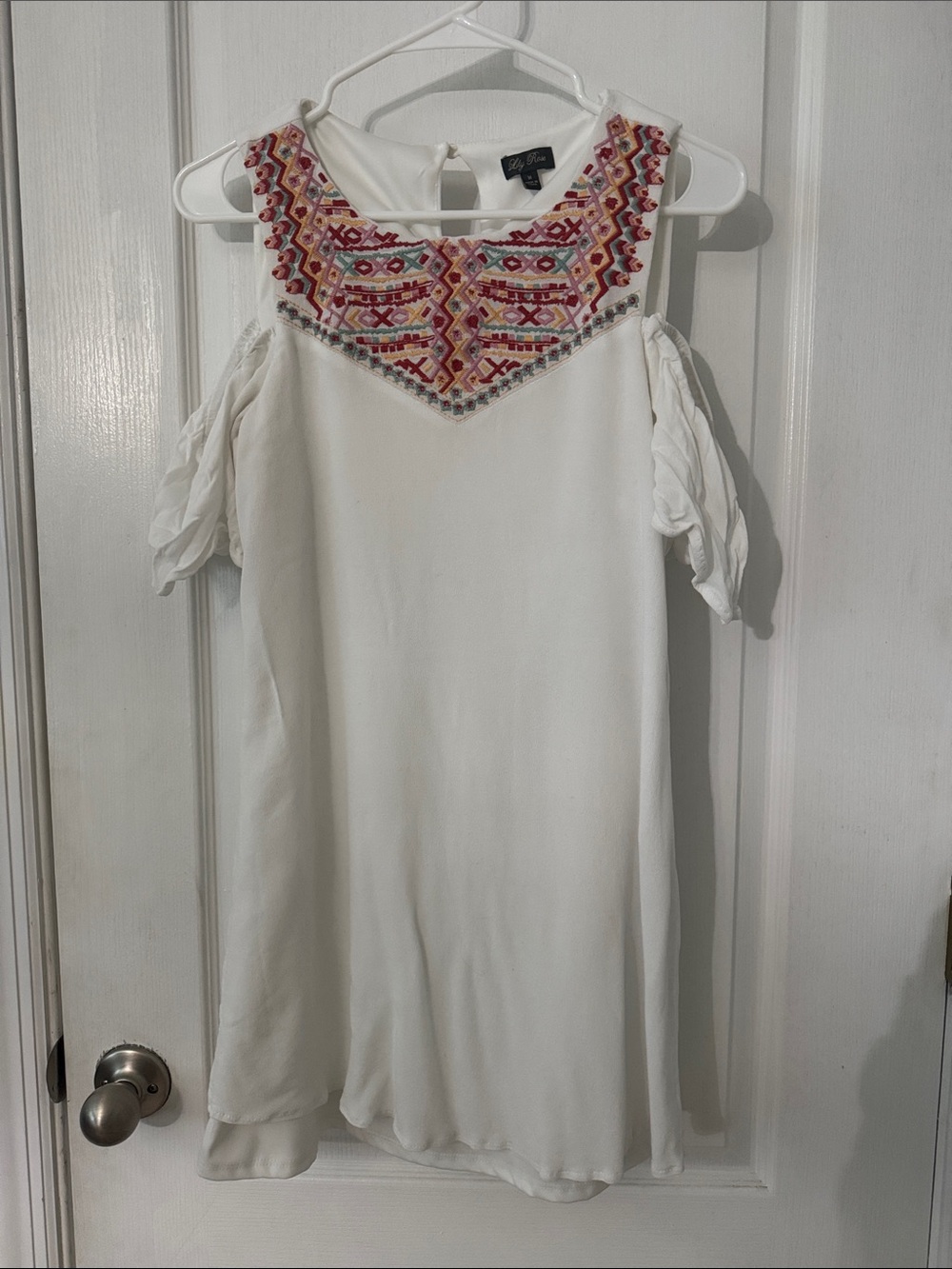 White dress, very cute and comfortable. Has cut-out shoulders. Lined